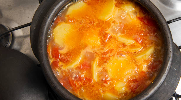 istock fish being cooked in a clay pot 1240799158