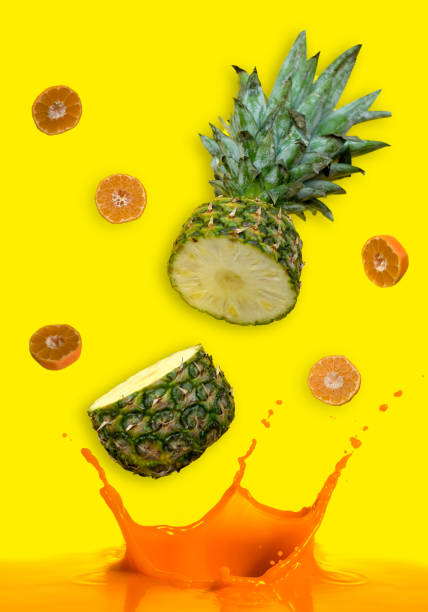 istock pineapple and tangerines in motion 1240810418