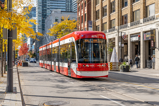 Toronto, Canada - October 24, 2019: Bus on the King street west  looking West from Simcoe St. in Toronto, Canada.