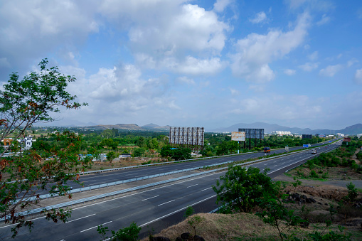 Pune, India - June 16 2019: The Mumbai Pune Expressway early morning near Pune India. The Expressway is officially called the Yashvantrao Chavan Expressway.