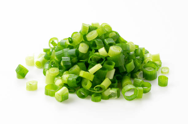 istock Carved green onions placed on a white background 1240900963
