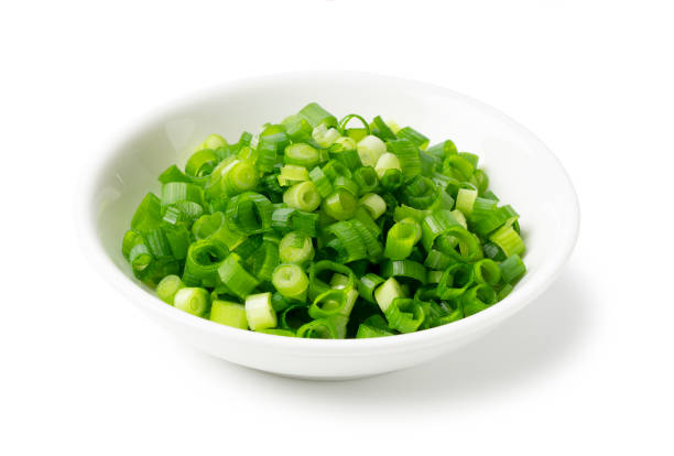 istock Carved green onions placed on a white background 1240901990