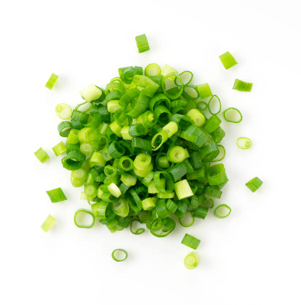 istock Carved green onions placed on a white background 1240905571