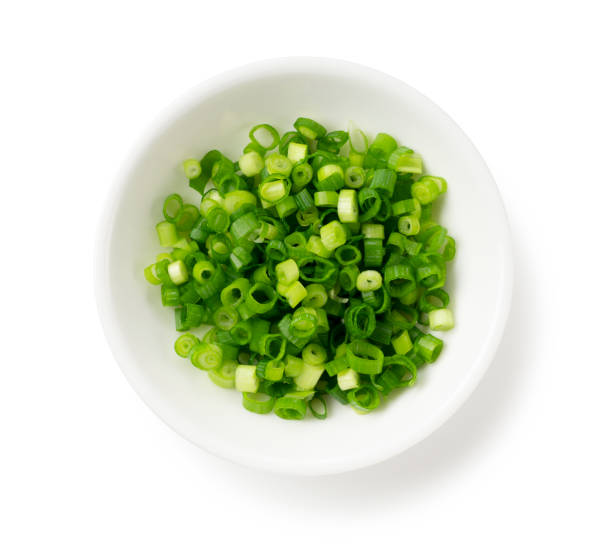 istock Carved green onions placed on a white background 1240919438