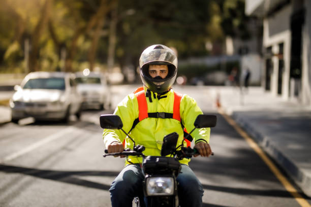 istock Delivery man riding a motorcycle - motoboy 1240951133