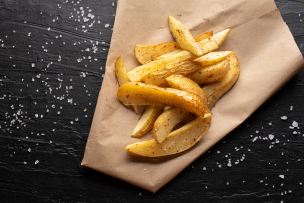 istock French fries on dark background 1240962767
