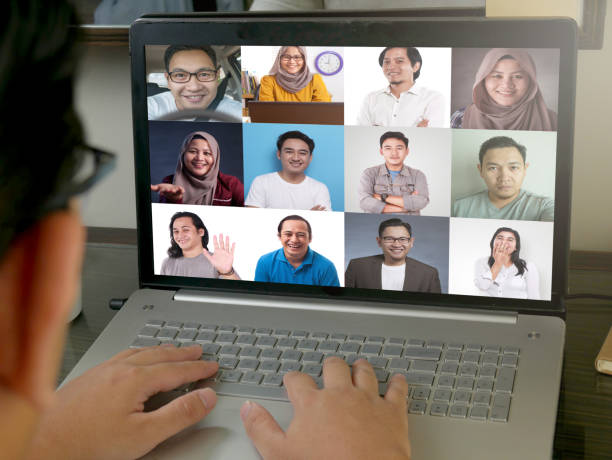 istock Teleconference during work from home due to coronavirus covid pandemic. Webcam pc screen views during group video call shows people participated in online meeting 1240968139