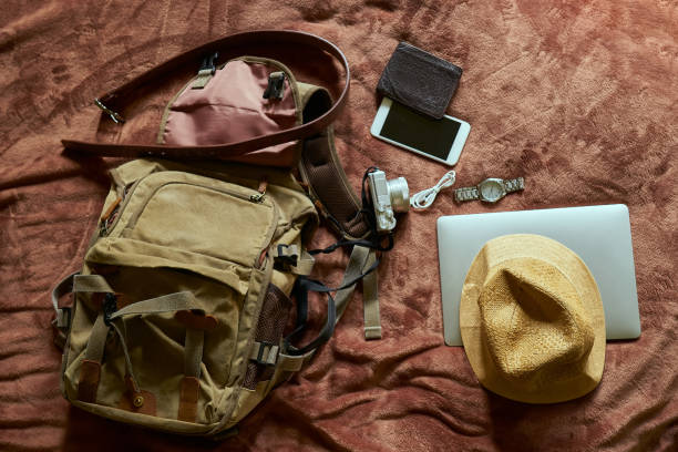 istock Concept travel prop with a hat and bag and laptop 1240971594