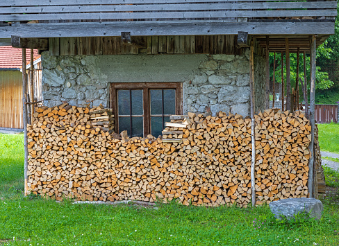 House with fresh layered firewood in Bavaria