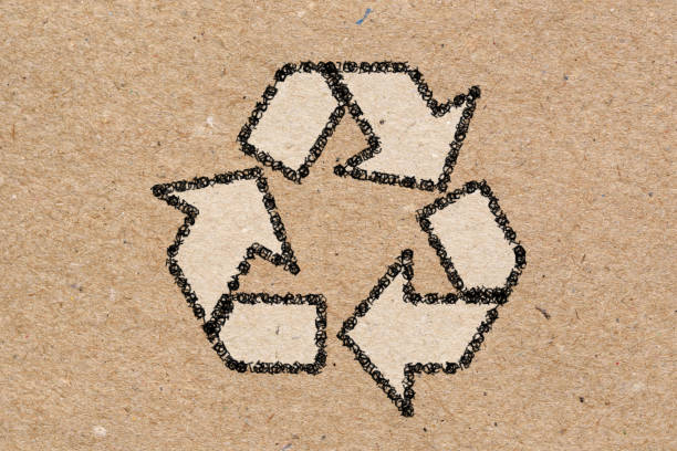 istock Recycling symbol on brown craft paper background. 1241009532