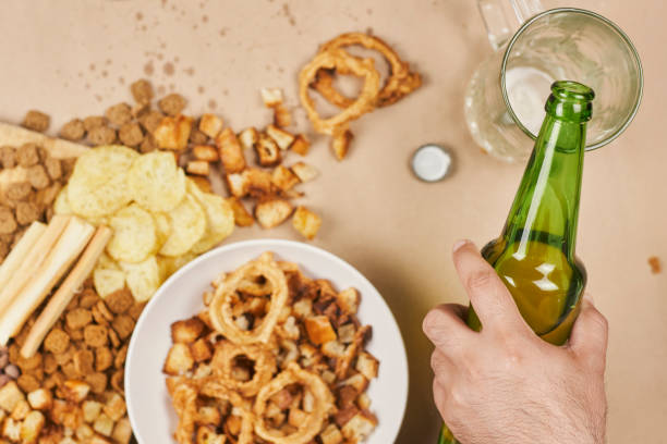 istock Drinking beer. Table full of beer snacks 1241024542