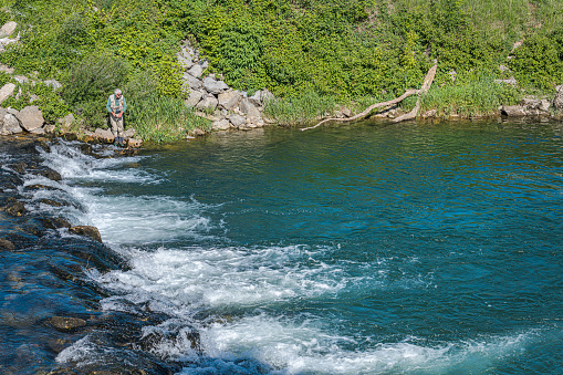 Senior Fly Fisherman on the Vipava river in Primorska,Slovenia,Europe,Nikon D850
