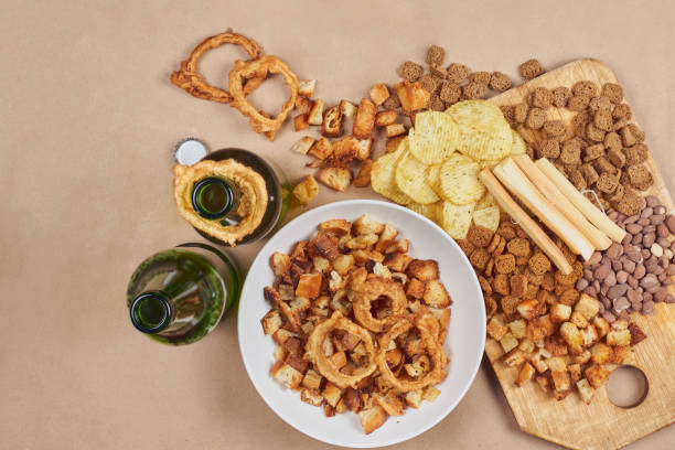istock Drinking beer. Table full of beer snacks 1241061059