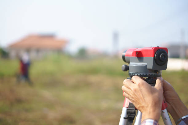 istock Hand using total station or electronic distance measurement for building or construction site 1241065901