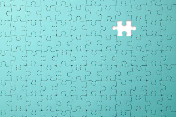 missing piece of a blank light blue jigsaw puzzle - teamwork absence blank jigsaw puzzle imagens e fotografias de stock