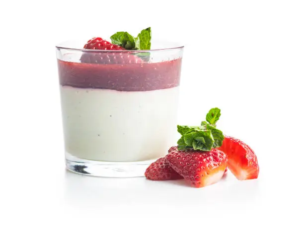 Italian dessert panna cotta with strawberries isolated on white background.