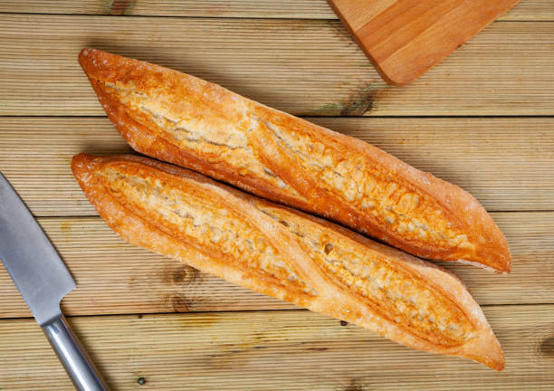 istock Freshly baked white baguette 1241091483