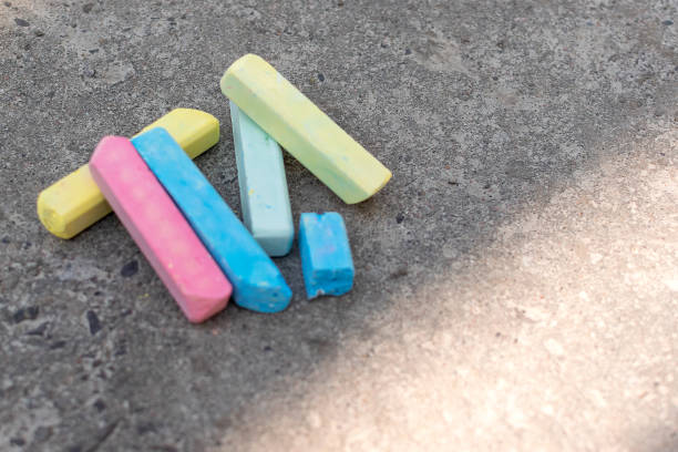 istock Multi-colored crayons lie on the pavement. Crayons for drawing 1241132458