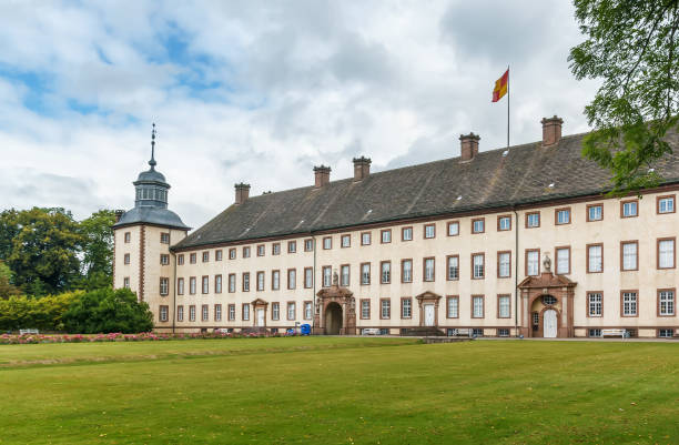 View on Schloss Burg and deciduous forest with coniferous trees in right foreground. The fortress, located in Solingen at river Wupper, is the largest reconstructed castle in North Rhine Westphalia, Germany and a popular tourist attraction.