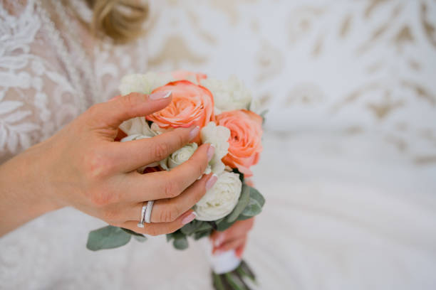 istock bride holds a wedding bouquet in her hands 1241153471