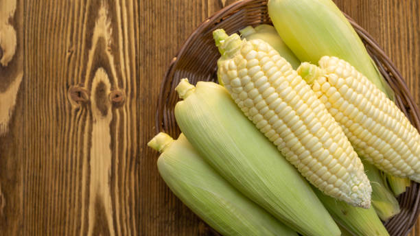 istock Pure white corn on a wooden table. 1241180111