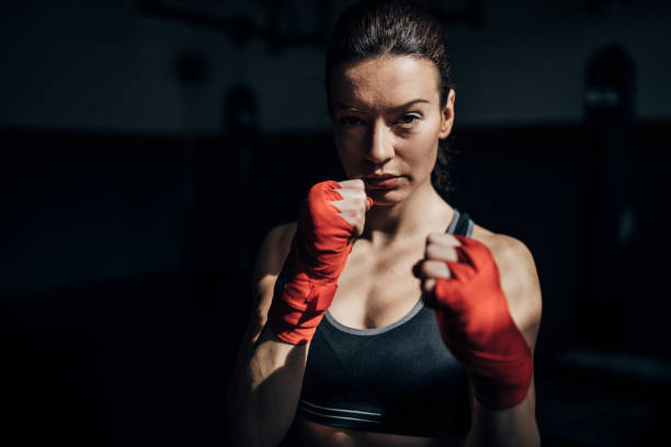 istock Portrait of beautiful kickboxer exercising 1241193336