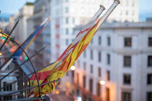 Concept of protest suspended, rolled flag on balcony of building