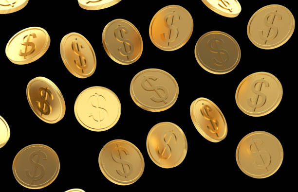 istock Gold coins with a dollar sign as background on a black 1241199790