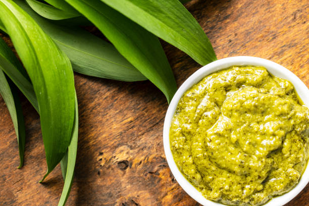 istock Wild garlic pesto and green ramsons leaves. 1241203467