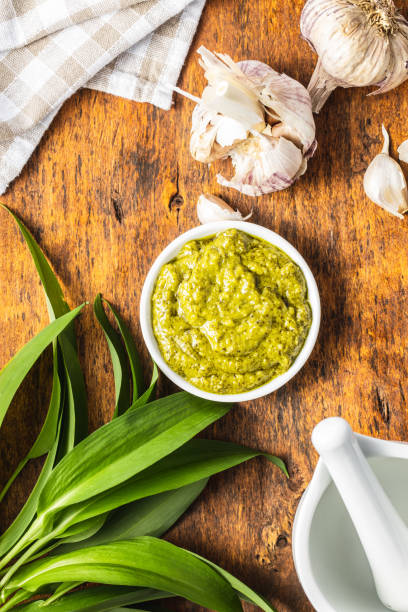istock Wild garlic pesto and green ramsons leaves. 1241203470