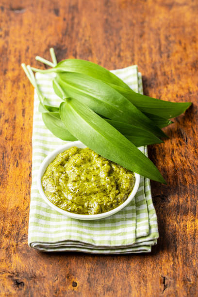 istock Wild garlic pesto and green ramsons leaves. 1241204502