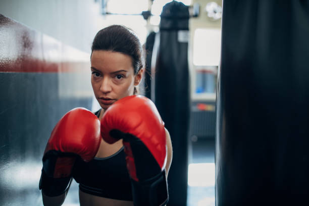 istock Beautiful woman kickboxer training 1241206231