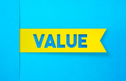 Yellow Label Sticker On A Blue Background. Value Concept. Horizontal composition with copy space. Care Concept.