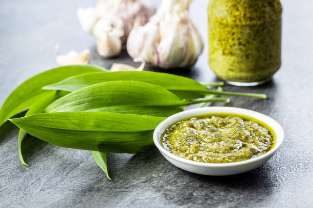 istock Wild garlic pesto and green ramsons leaves. 1241217239