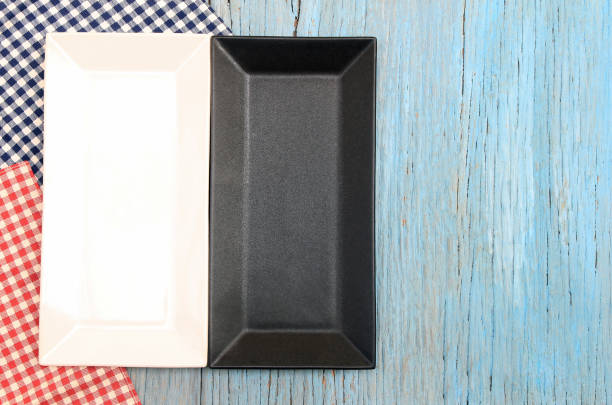 istock black and white plate on tablecloth on wood table background 1241225138