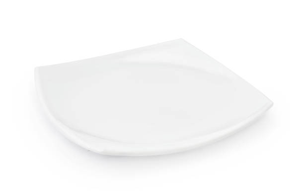 Empty white plate isolated on a white background. stock photo
