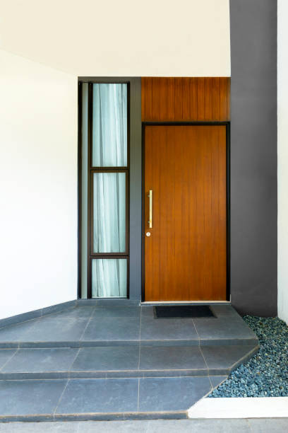 istock Wooden front door with window glass 1241234519