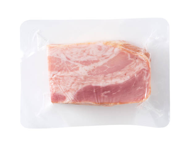 istock Angled shot of bacon placed on a white background 1241235060
