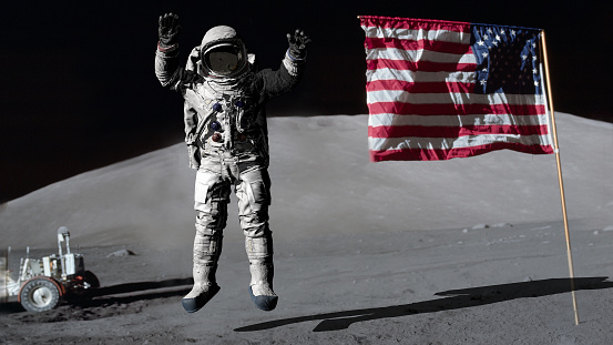 3D rendering. Astronaut jumping on the moon and saluting the American flag. CG Animation. Elements of this image furnished by NASA. https://www.hq.nasa.gov/office/pao/History/alsj/a17/AS17-134-20386.jpg