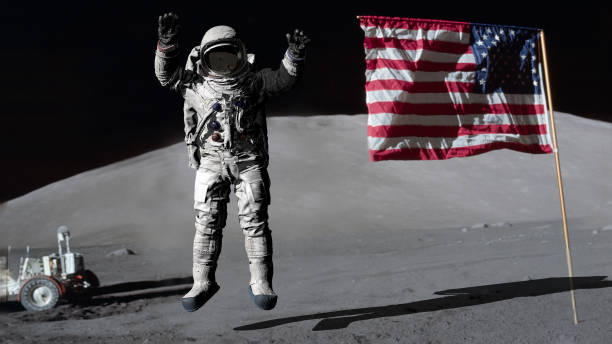 3D rendering. Astronaut jumping on the moon and saluting the American flag. CG Animation. Elements of this image furnished by NASA. 3D rendering. Astronaut jumping on the moon and saluting the American flag. CG Animation. Elements of this image furnished by NASA. https://www.hq.nasa.gov/office/pao/History/alsj/a17/AS17-134-20386.jpg apollo 11 stock pictures, royalty-free photos & images