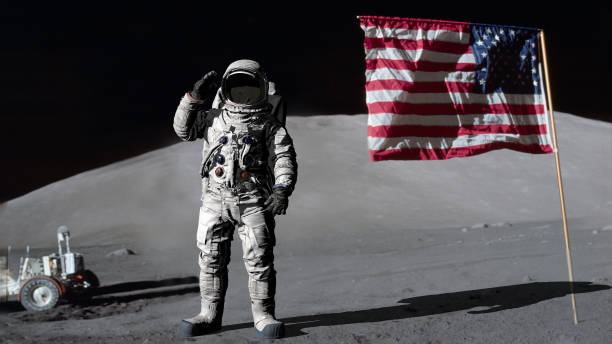 3D rendering. Astronaut saluting the American flag. CG Animation. Elements of this image furnished by NASA. 3D rendering. Astronaut saluting the American flag. CG Animation. Elements of this image furnished by NASA. https://www.hq.nasa.gov/office/pao/History/alsj/a17/AS17-134-20386.jpg apollo 11 stock pictures, royalty-free photos & images
