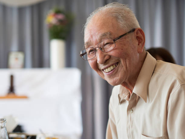 istock An old man talking animatedly at a family event 1241269271
