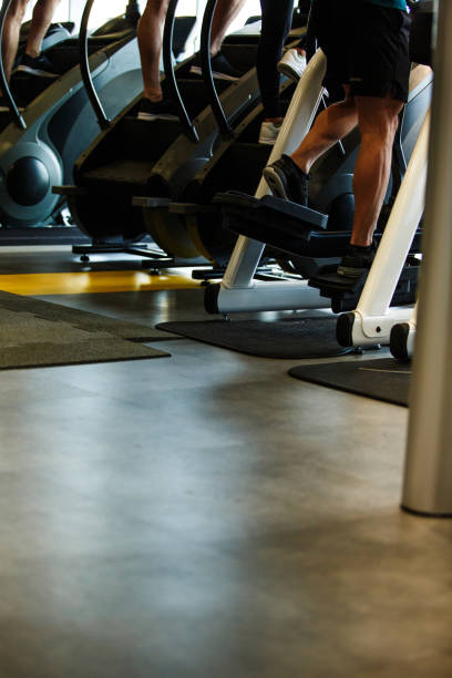 istock Small group of unrecognizable athletes using exercise machines at the gym 1241280518