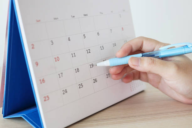 istock Hand with pen writing on calendar date 1241287613