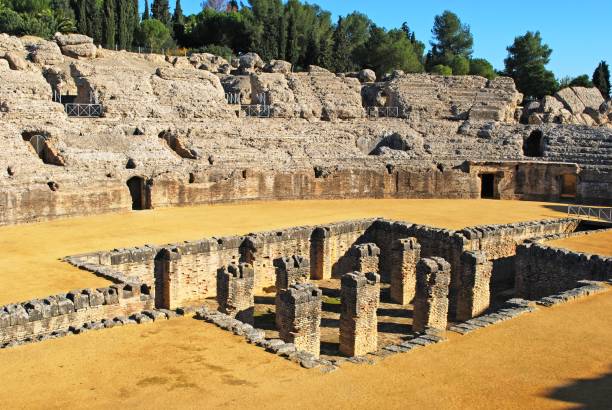 Roman Amphitheatre at Italica, Seville, Spain. Arena in the Amphitheatre at the Roman ruins of Italica, Seville, Seville Province, Andalusia, Spain, Europe. italica spain stock pictures, royalty-free photos & images