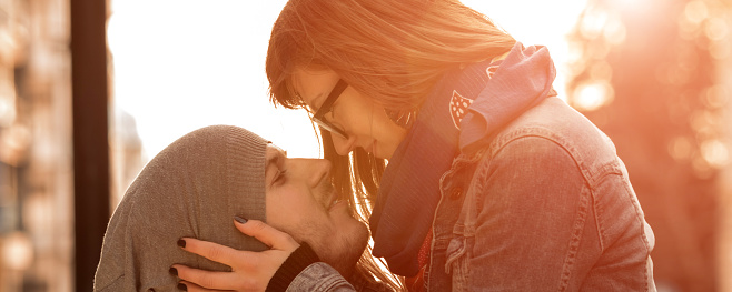 Happy smiley couple enjoying on the street.