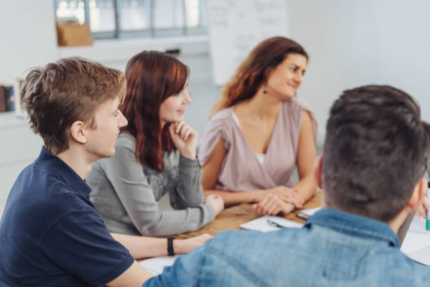 istock Three young people listening in a meeting 1241314061