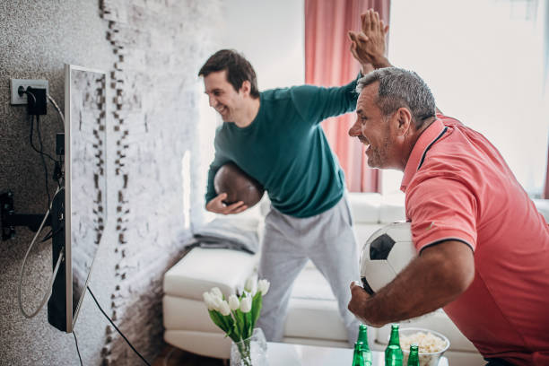 istock Smiling fans celebrate the victory 1241326921