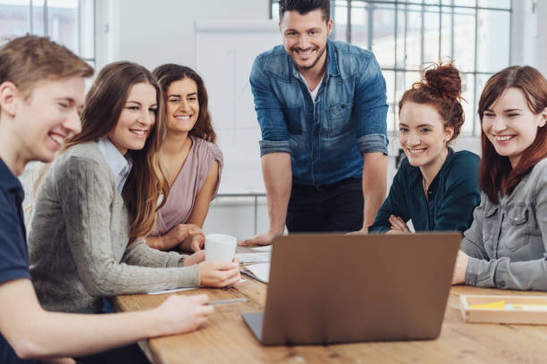 istock Happy successful business team looking at a laptop 1241327245