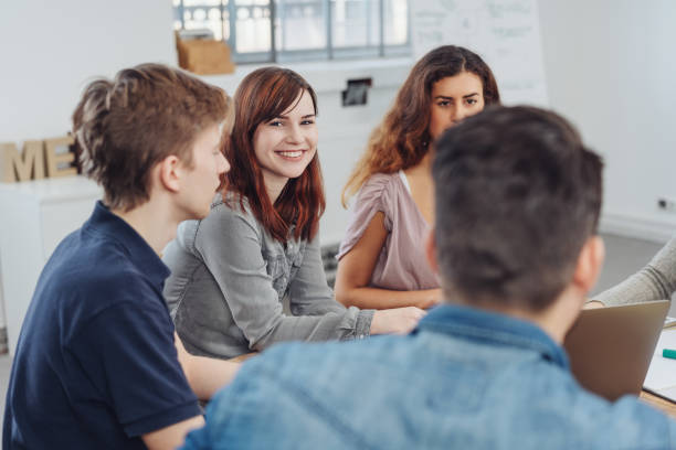 istock Smiling friendly woman in a meeting 1241335708